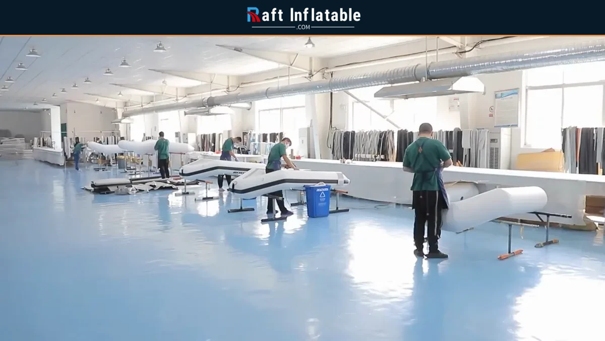 Wide view of workers and inflatable boats on the supplier production floor